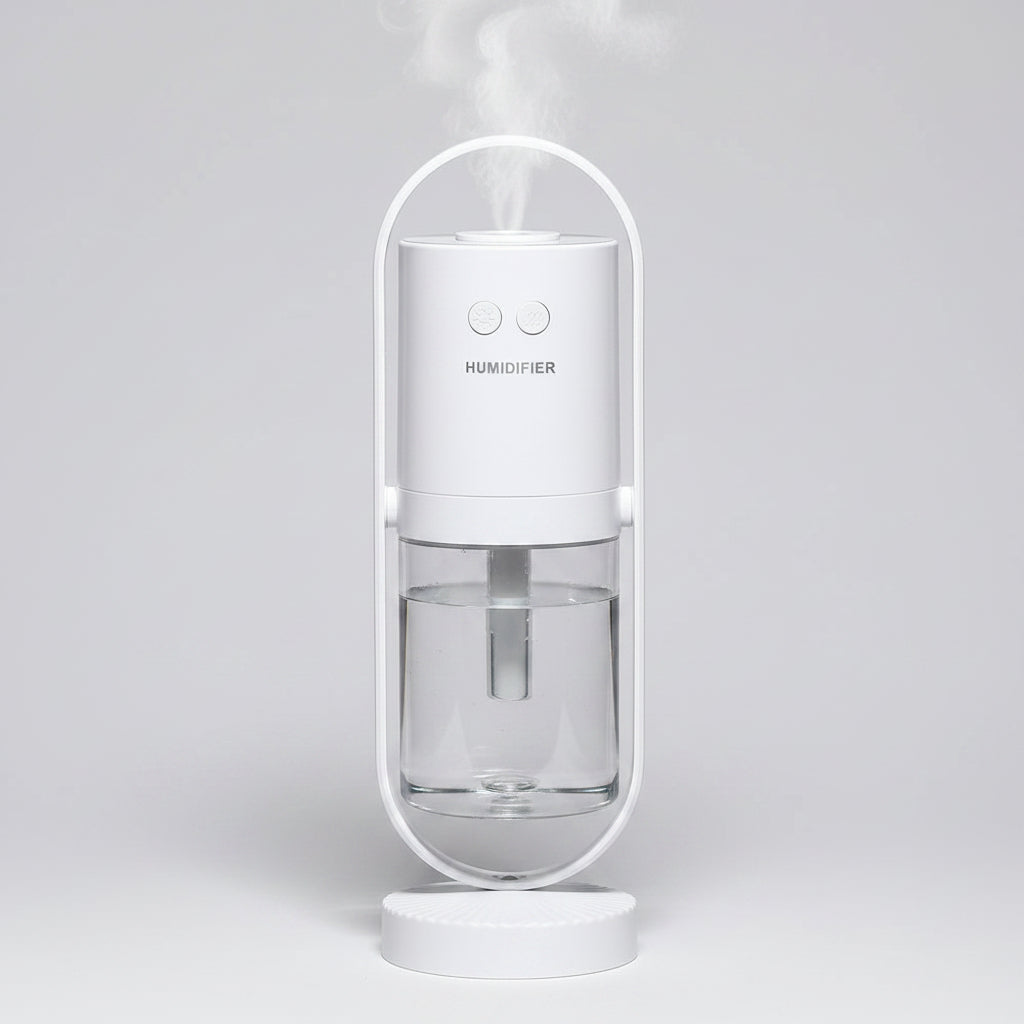 White humidifier with clear water tank on a white background