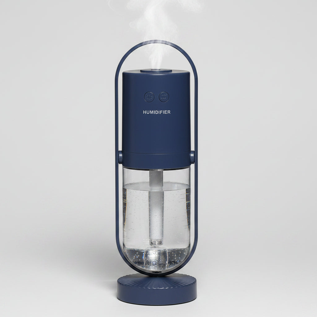 Navy blue humidifier with clear water tank on a white background