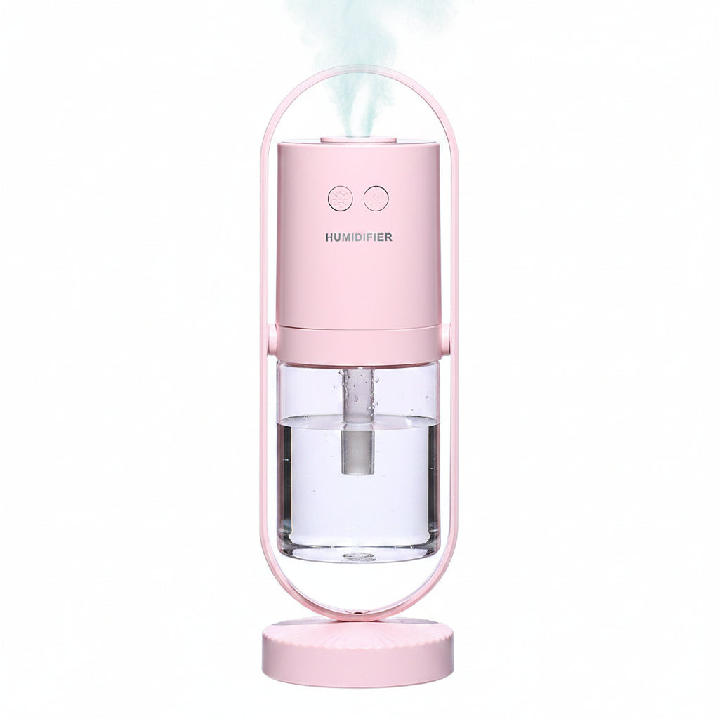 Pink humidifier with clear water tank on a white background