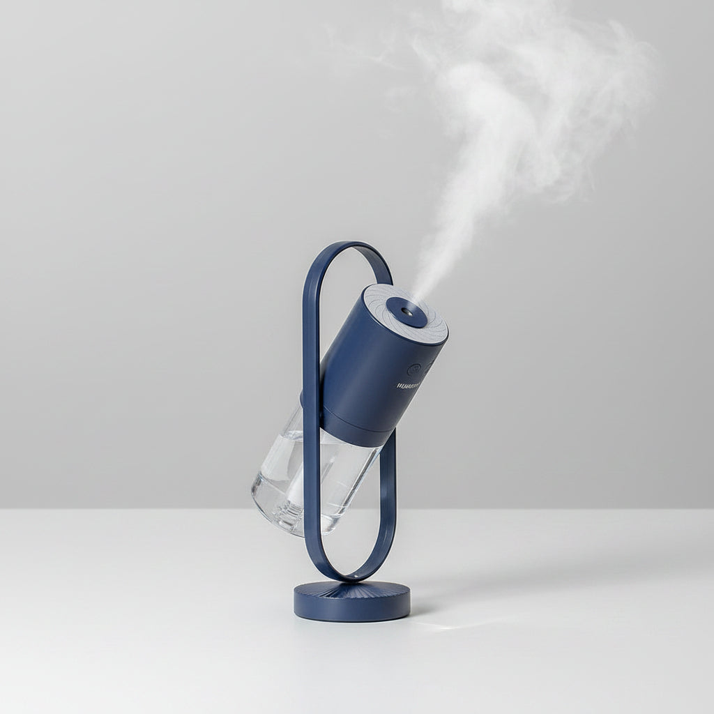 Blue humidifier on a white surface with steam escaping, next to a vase with dried leaves.